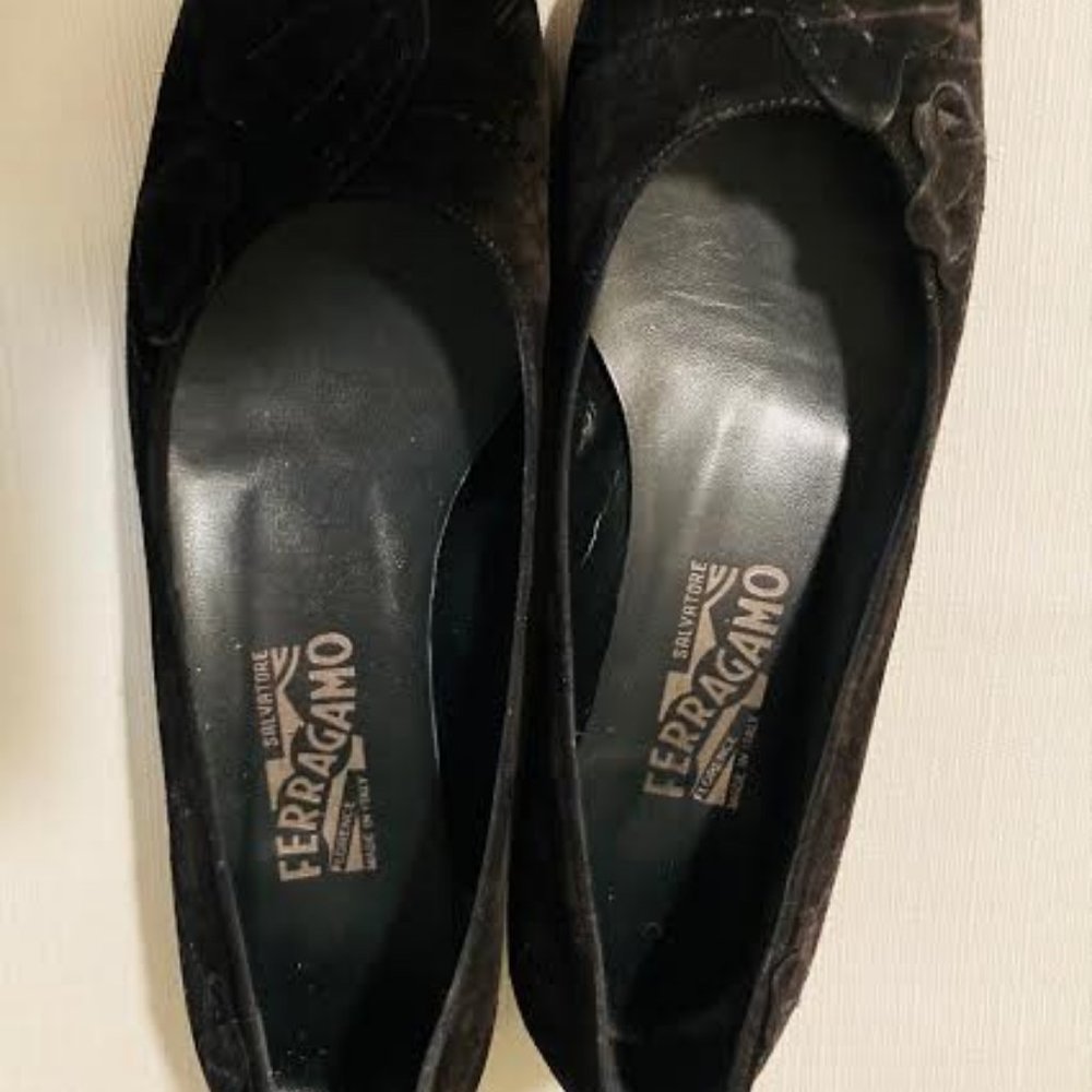 Salvatore Ferragamo black flat suede shoes.